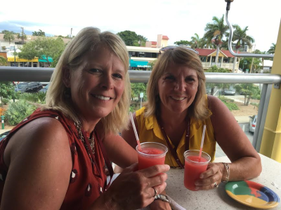 Two women enjoying cocktails on food tour in Sarasota, FL