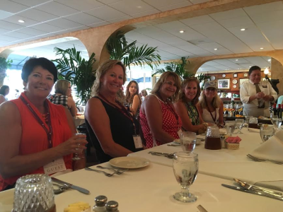 Group of tourists seated for dinner at a restaurant in Sarasota, FL