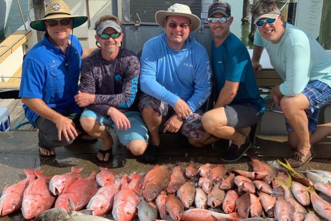 a group of people sitting on the ground