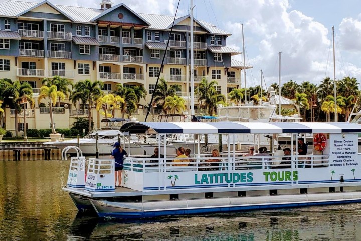 a boat is docked next to a body of water