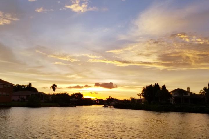 a sunset over a body of water