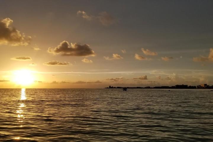 a sunset over a body of water