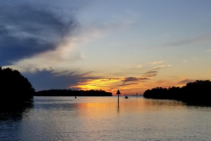 a sunset over a body of water