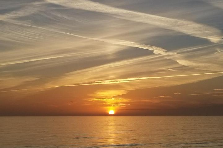 a sunset over a body of water