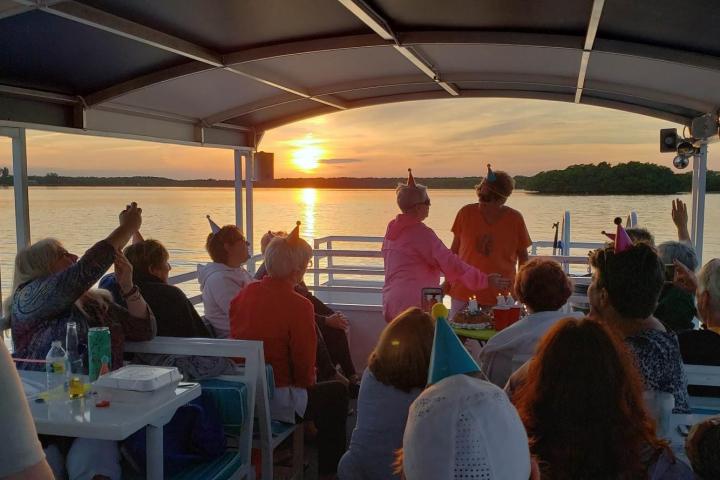 a group of people sitting at a table
