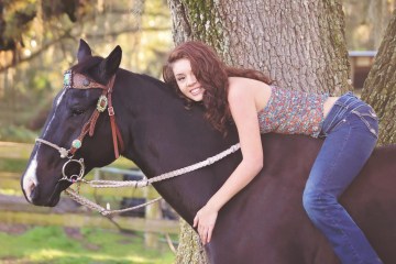 a woman riding a horse