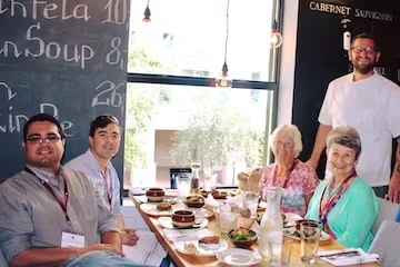 a group of people sitting at a table