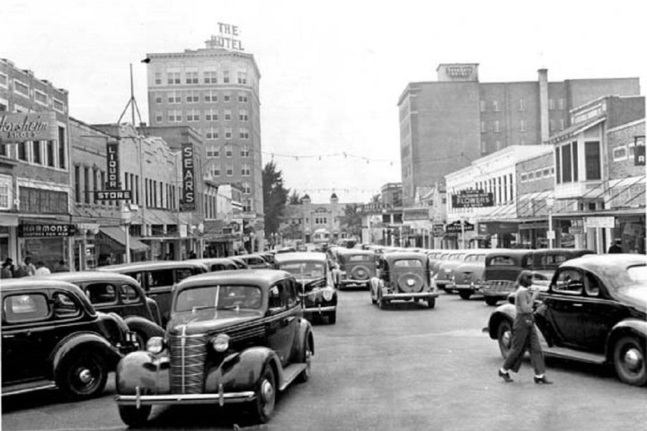 a car driving down a busy city street