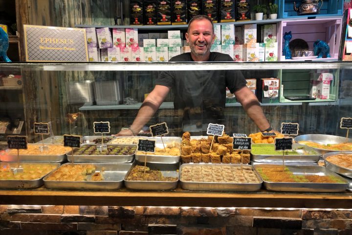 a person standing in front of a store